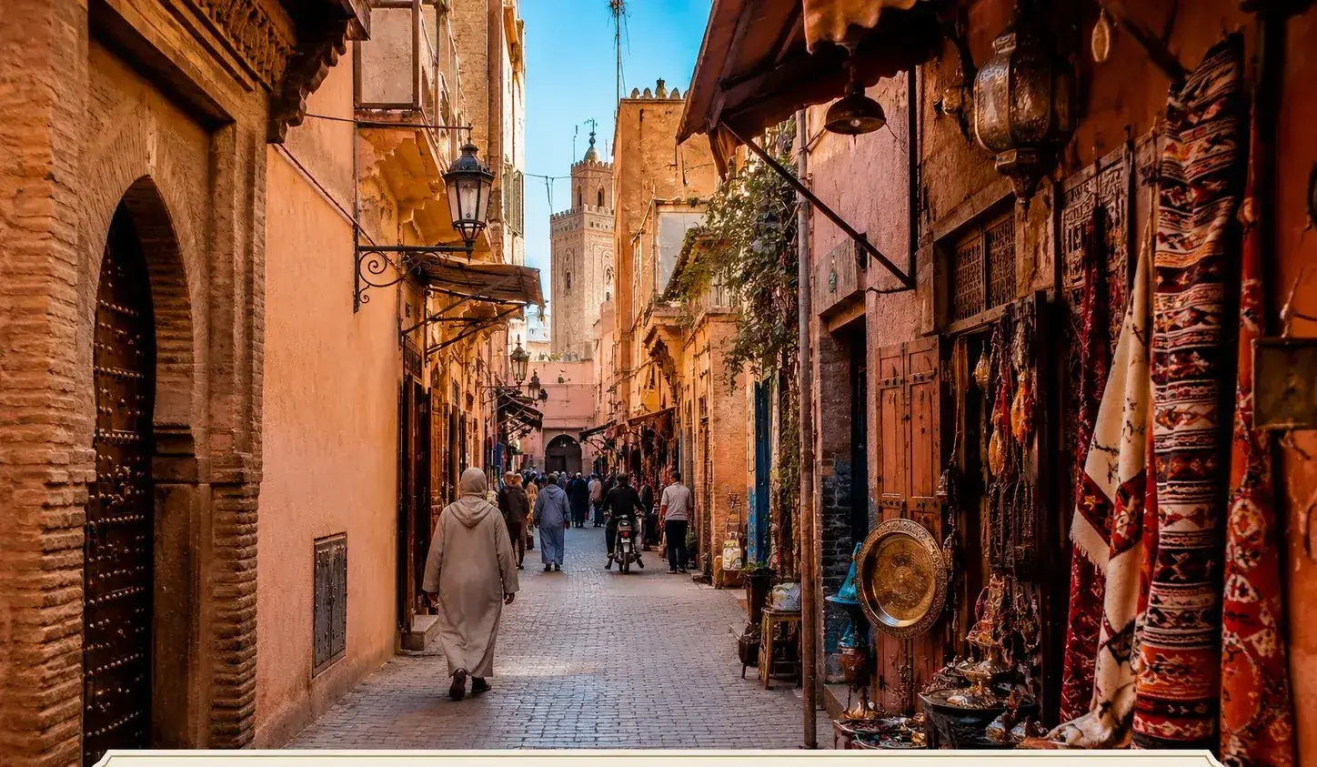 Traditional souk lane in the Marrakech Medina with carpets and lanterns