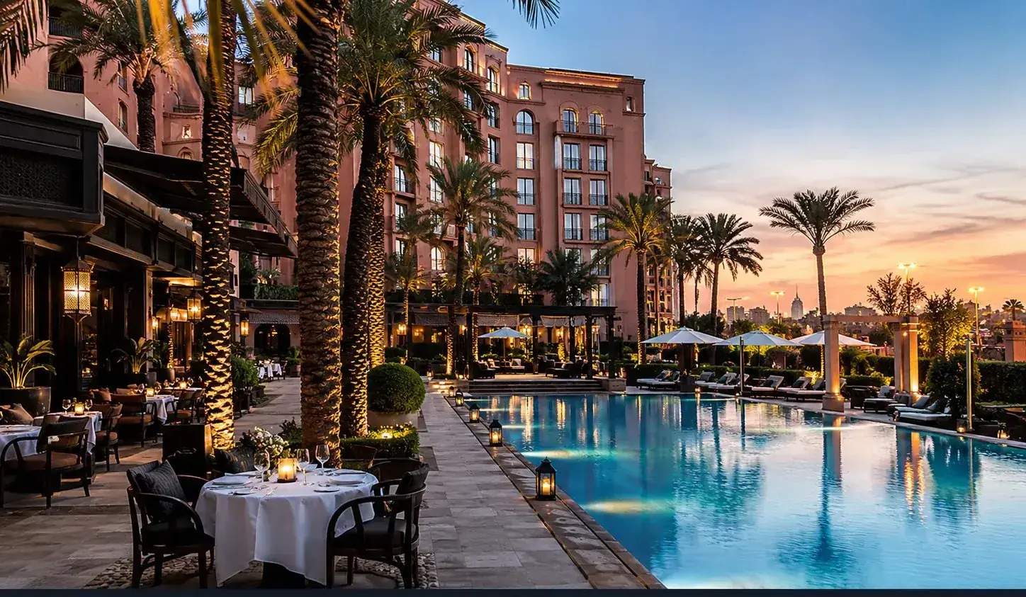 Luxury hotel pool and gardens at dusk in Hivernage, Marrakech